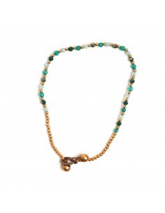 Tobillera de bronce combinada con piedra.