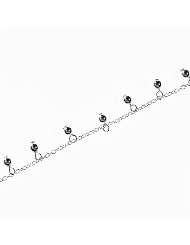 Tobillera de Plata con bolitas colgando.